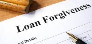 "Loan Forgiveness" printed on a sheet of paper with a pen over it.