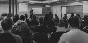 Black and white photo of a lecture.