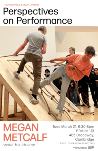 People gather around a wooden board that is tilted and has knotted ropes. Two people in casual clothes stand on the board and pull on ropes leaning sideways.