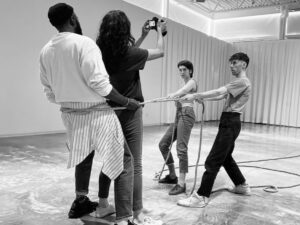Black and white photo of dancers and videographer at the ArtLab.