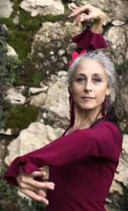Image of flamenca dancer with her arms raised