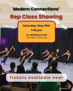 Seated audience members watch various dancers moving across a stage.