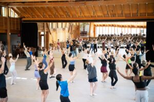 Dancers moving together in Perles Family Studio at Jacob's Pillow
